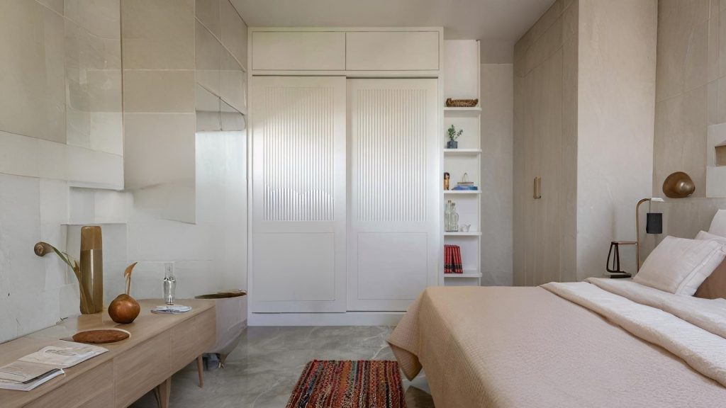 Minimalist sliding wardrobe design for small apartment bedroom