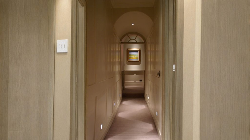 Modern corridor with ambient lighting and mirror illusion